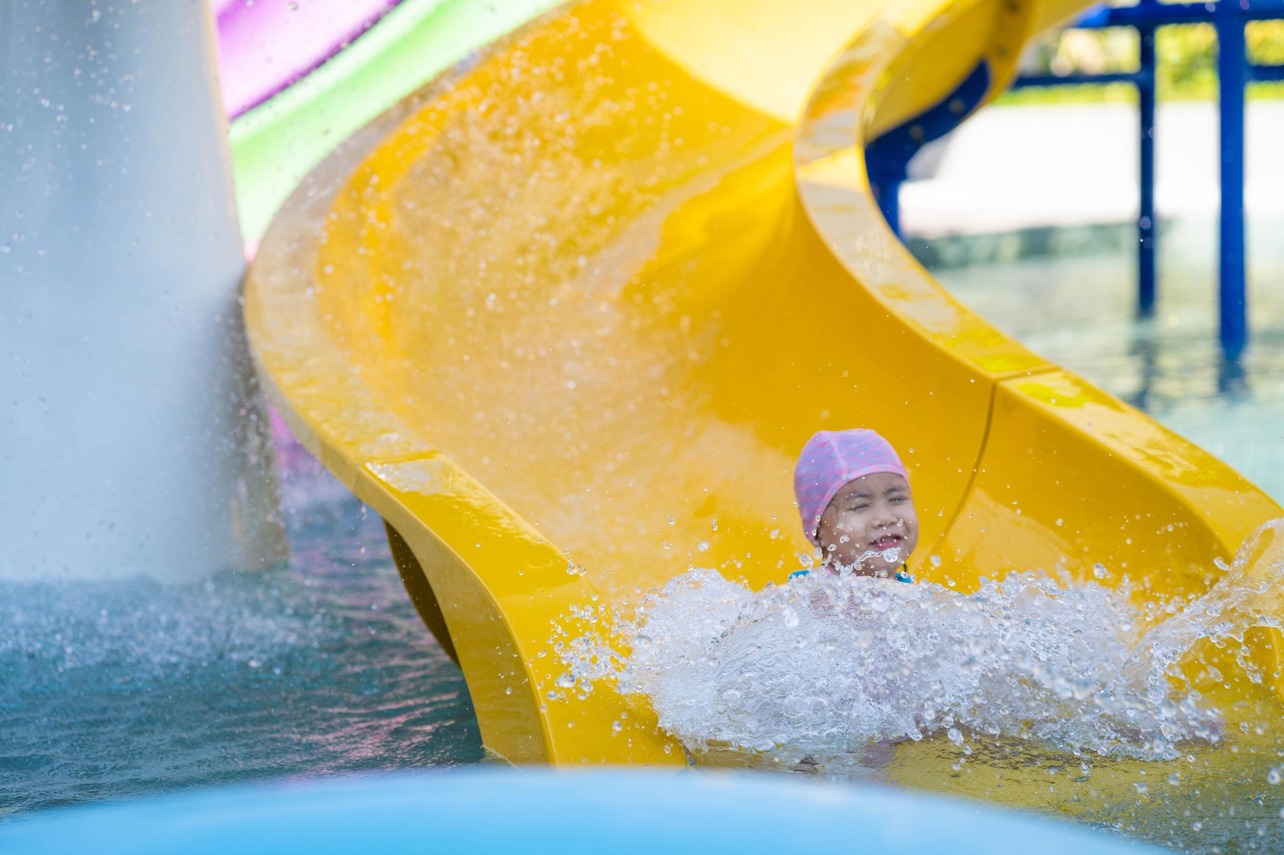 Waterpark little girl on the slide