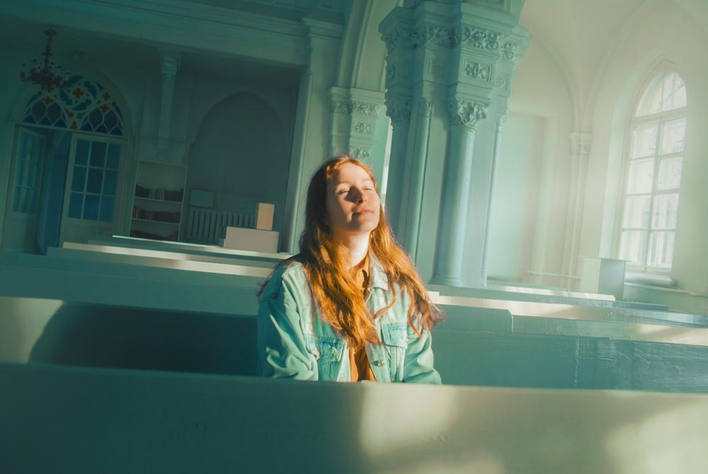 Woman Sitting in Church
